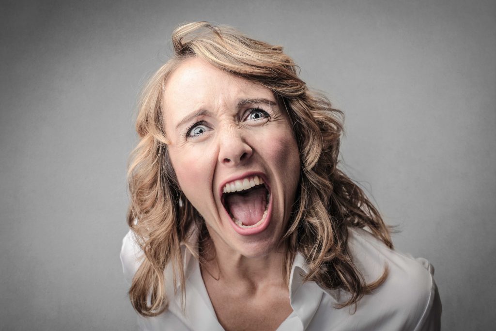 Woman showing frustration and angry emotion